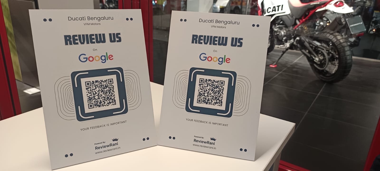 ReviewRani QR review stands on display at VFM Ducati Bengaluru