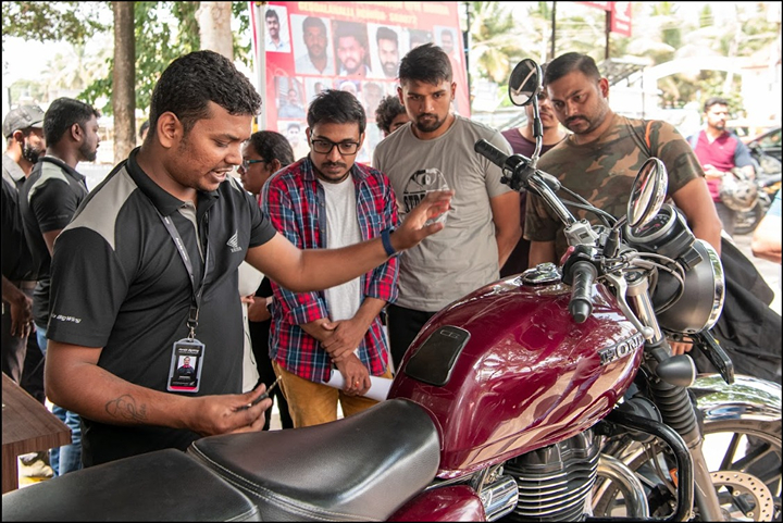 VFM Honda sales executive with customers around a CB350